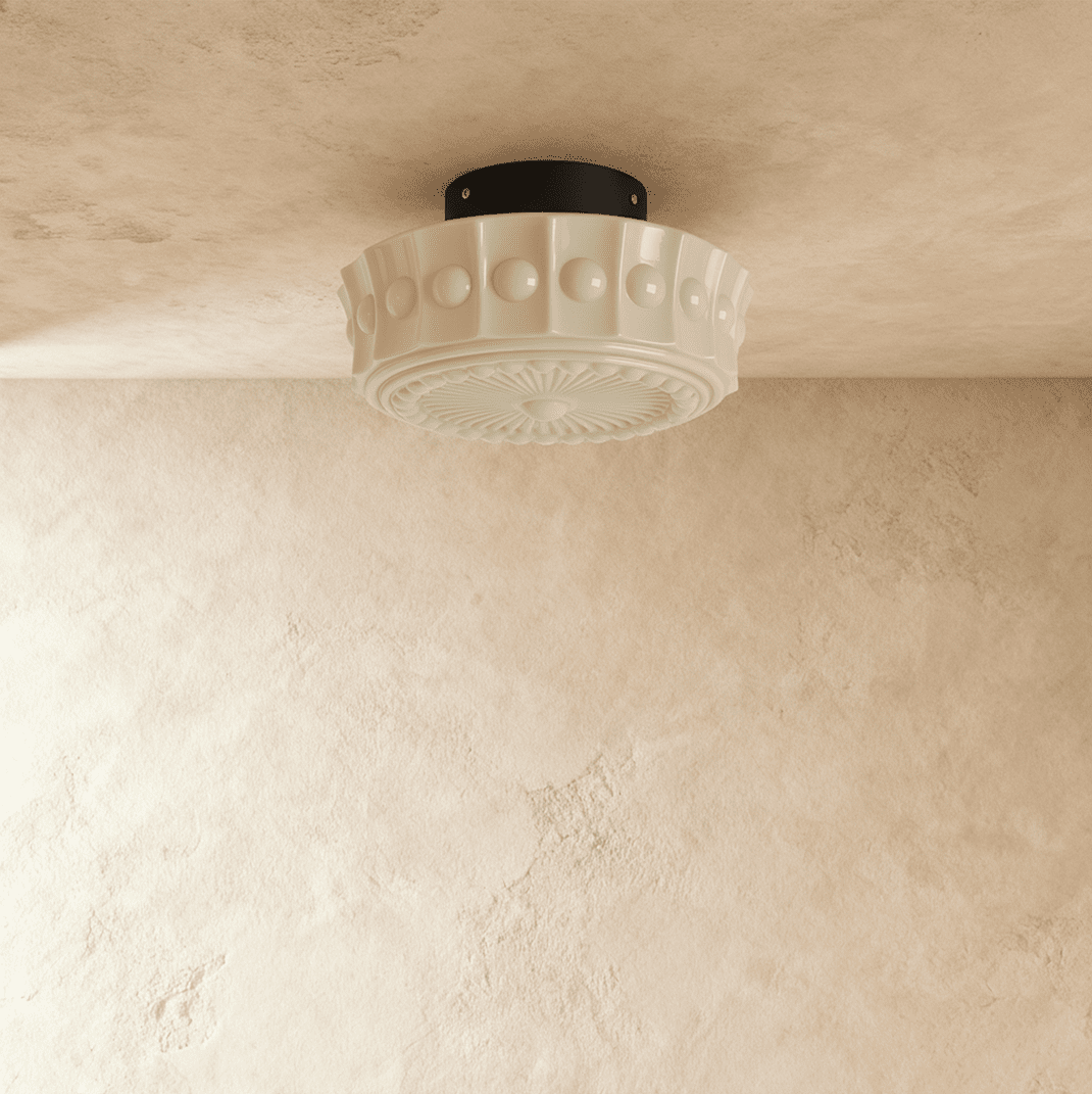 Clérachic cream flush ceiling light unlit, a fluted glass shade with raised beads and a sunburst base on a black canopy.