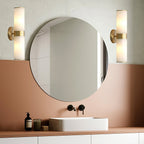 The Clérachic Sway mounted as a pair either side of a round vanity mirror above a terracotta washstand.