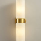 The Clérachic Sway in tight close up, brushed brass band bright against the glowing alabaster.