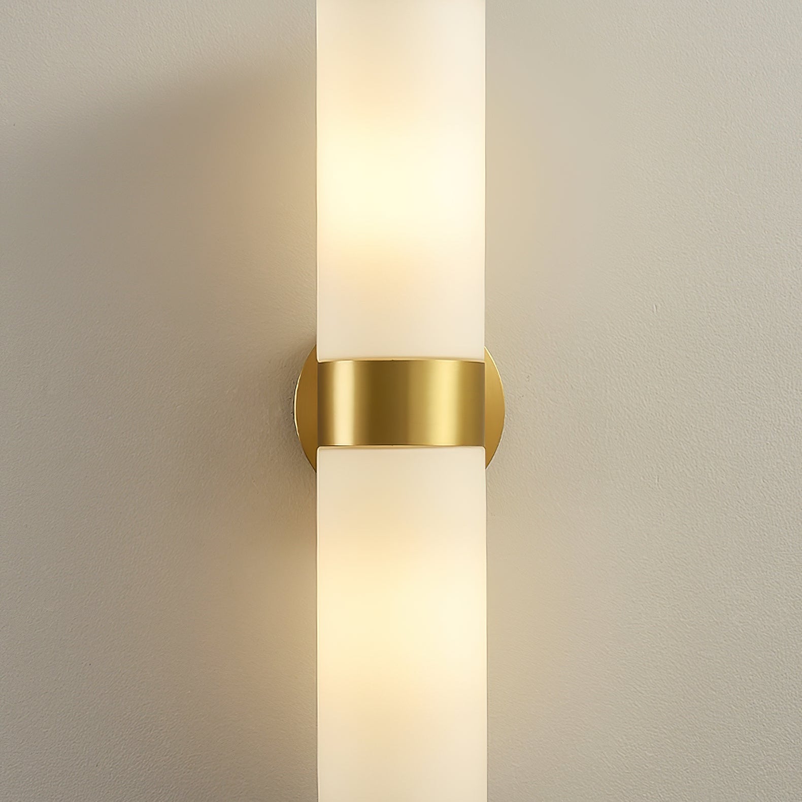 The Clérachic Sway in tight close up, brushed brass band bright against the glowing alabaster.