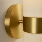 Clérachic Sway in macro, brushed brass backplate and centre band set against the cream alabaster.