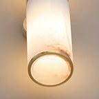 The Clérachic Sway viewed from underneath, brass ring open to show the bulb inside the stone shade.
