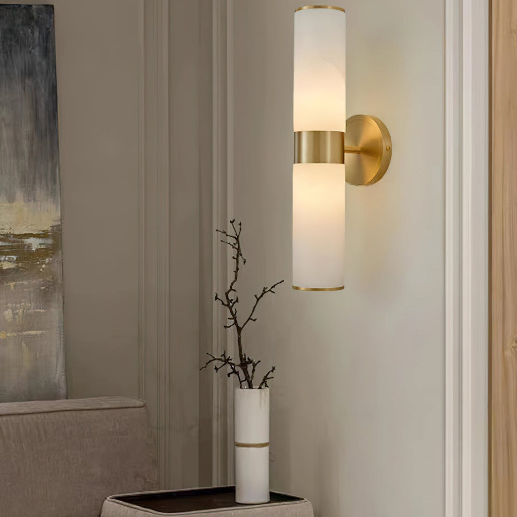 The Clérachic Sway warming a neutral hallway above a console with bare branches in a slim vase.