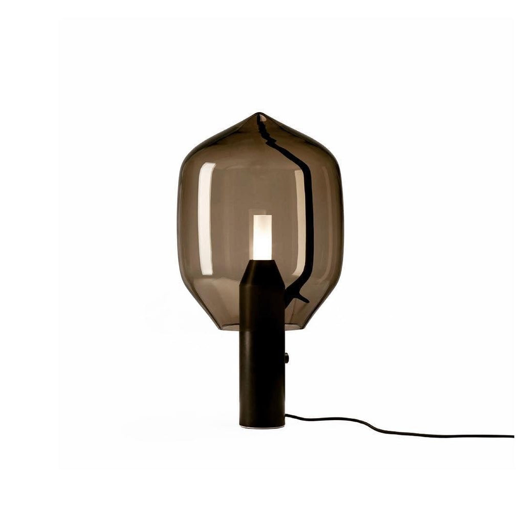 Clérachic's smoked-glass lamp on a black base, the inline switch and cord shown clearly against a white background.