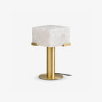 Cutout view of this Clérachic table lamp in brass, its alabaster block shade held by slim bracket clips.