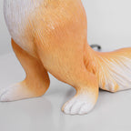 Close view of the squirrel's hind legs, orange fur and white-tipped tail on this Clérachic resin lamp.