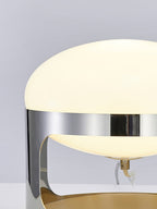 Close view of the opal dome and the polished chrome band on this Clérachic table lamp, with the small stem and cord visible inside.