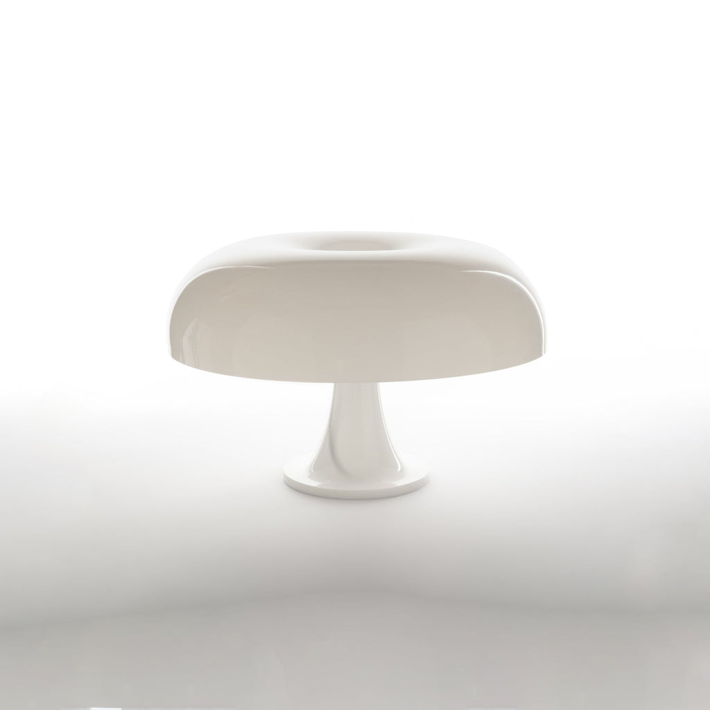 White dome table lamp from Clérachic on a plain white background with a soft reflection beneath the base.