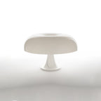 White dome table lamp from Clérachic on a plain white background with a soft reflection beneath the base.