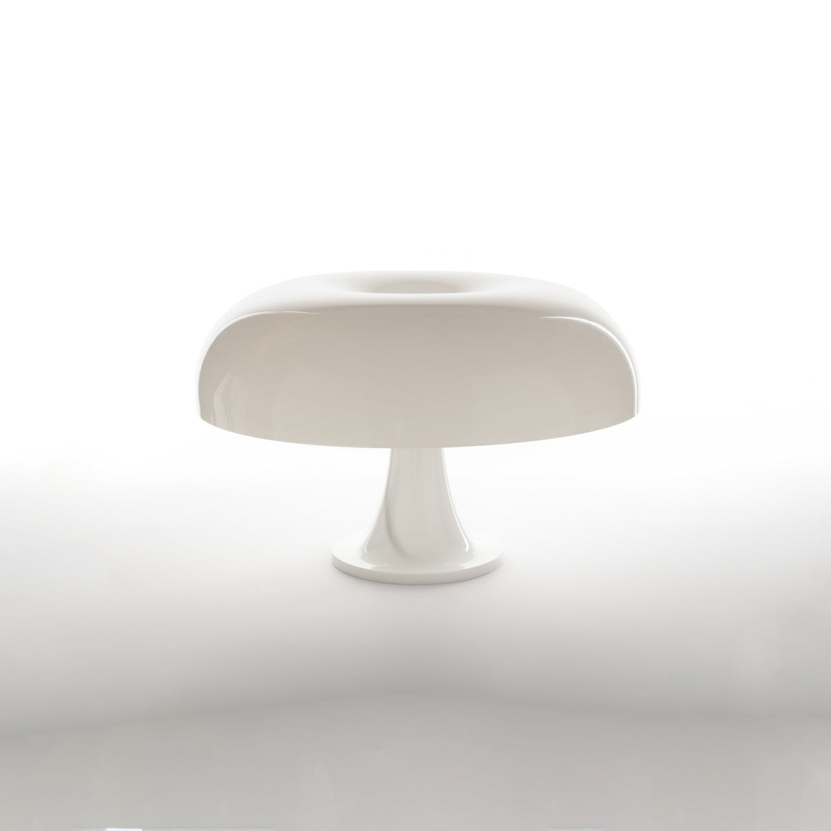 White dome table lamp from Clérachic on a plain white background with a soft reflection beneath the base.