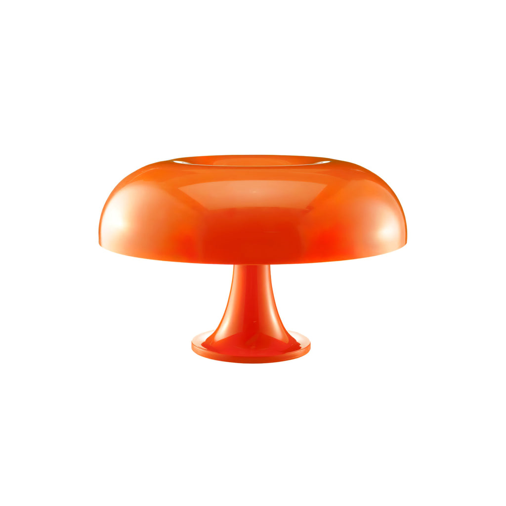 Orange Clérachic table lamp on white, with a rounded dome shade and a flared stem and base.