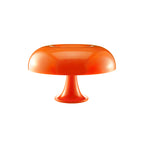 Orange Clérachic table lamp on white, with a rounded dome shade and a flared stem and base.
