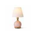 A small Clérachic table lamp with a pink marble ball base and a white shade, cut out on a plain white background.