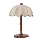 Clérachic table lamp with a walnut-coloured stem, brass collar and pull chain, cut out on a plain white backdrop.
