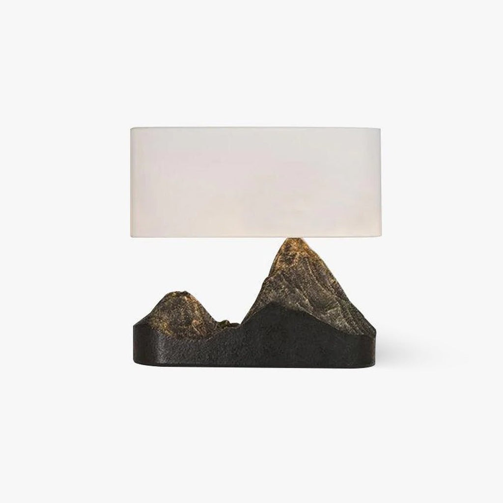 Front view of a Clérachic table lamp with a wide white rectangular fabric shade over a sculpted twin-peak mountain base, on a white backdrop.