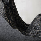 Close view of the rough, bronze-streaked mountain ridges rising from the black base of this Clérachic table lamp.