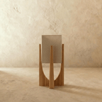 Rear view of the Clérachic table lamp in light wood, showing the woven linen shade and the curved frame legs.
