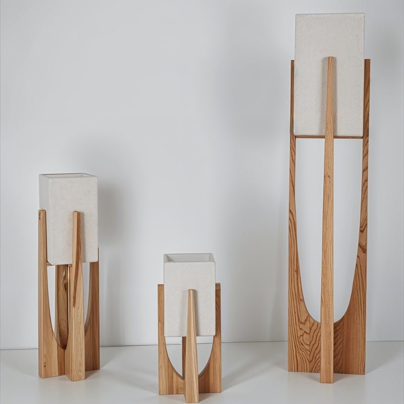 Clérachic light-wood lamps with textured stone-coloured shades in three heights on a plain pale background.