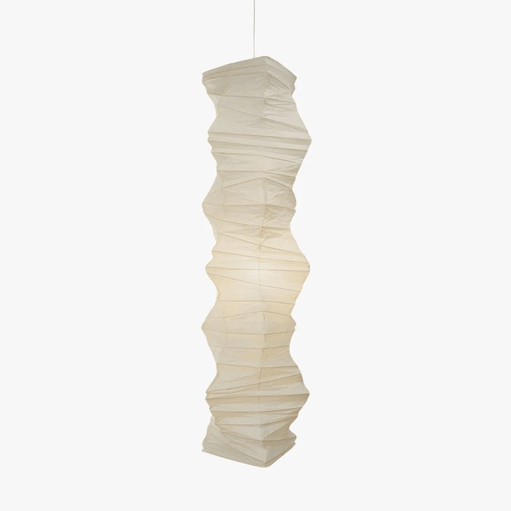 Clérachic crushed-paper wave-column pendant light shown unlit on a plain white background, its full height hanging from a slim cable.