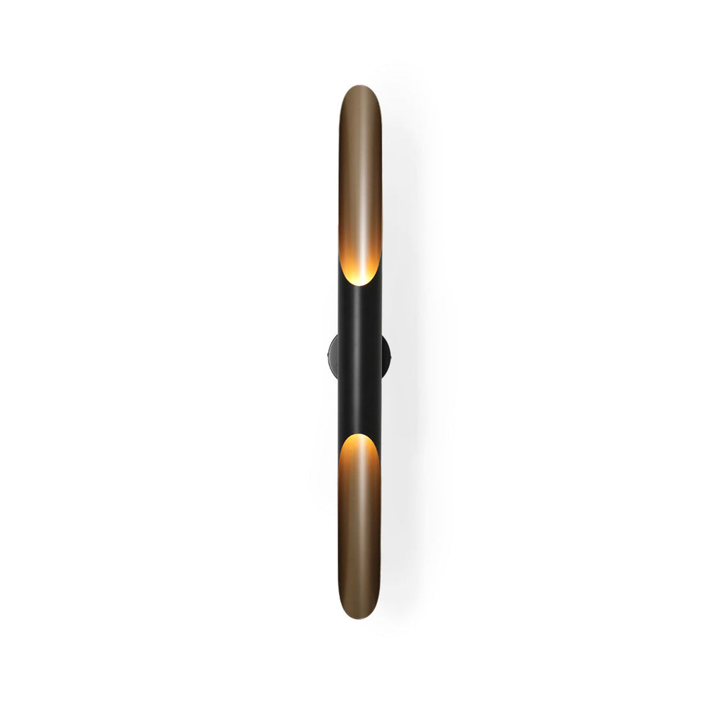 Close view of the black centre section and the gold-lined openings at each end of this Clérachic tube wall light, on white.