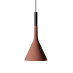 A brick-red concrete Clérachic pendant hung on a black cord against white, with a black collar above the shade.