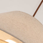 Close view of the woven linen texture on the shade of this Clérachic pendant, with the edge turned in.