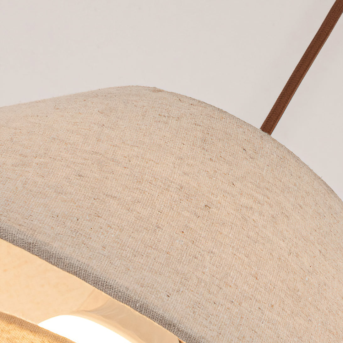 Close view of the woven linen texture on the shade of this Clérachic pendant, with the edge turned in.