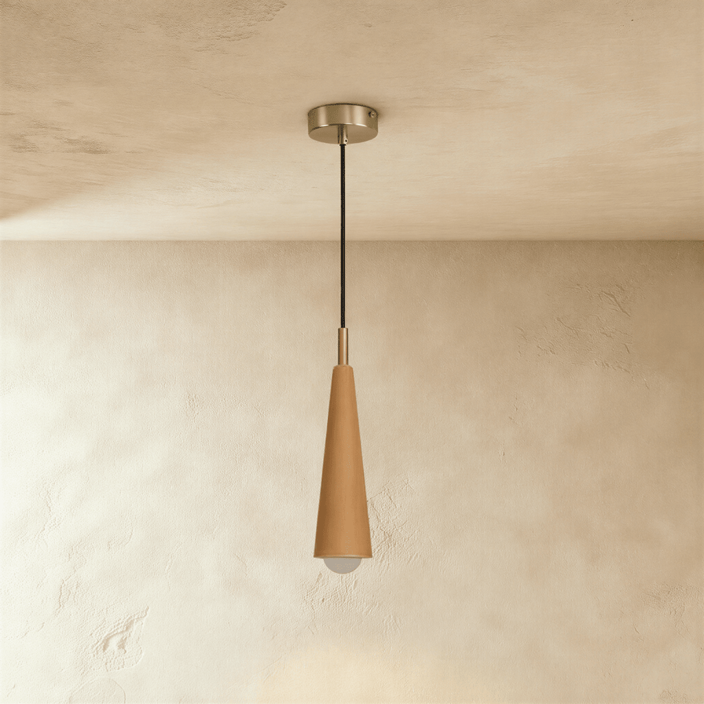 Clérachic slim light wood cone pendant with a brushed silver-tone canopy and cord, the globe bulb glowing under a plaster ceiling.