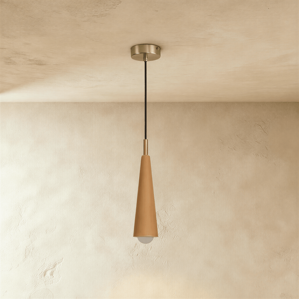 Clérachic slim light wood cone pendant with a brushed silver-tone canopy and cord, the globe bulb glowing under a plaster ceiling.