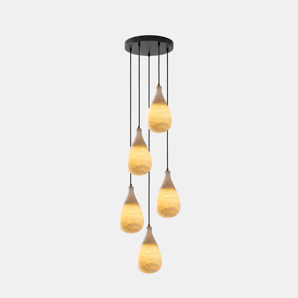 Five small lit alabaster drops hang at different heights from one round black canopy on this Clérachic cluster pendant.