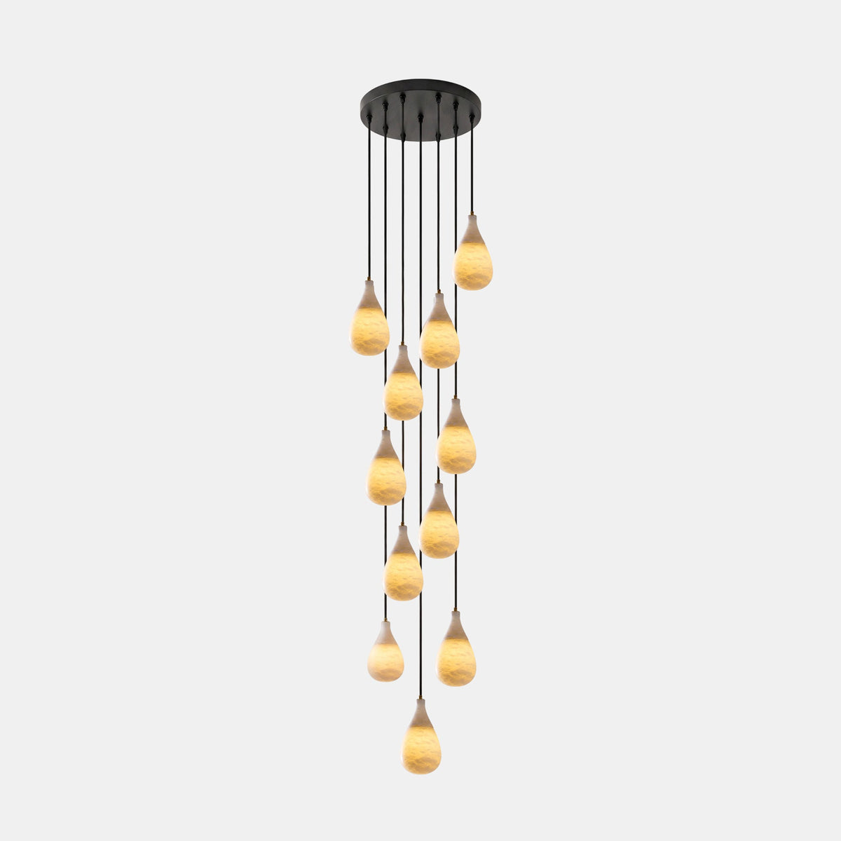 A long Clérachic cascade pendant, many glowing alabaster drops at staggered heights from a round black canopy.