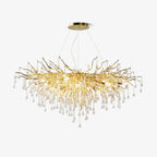 Clérachic teardrop chandelier on white, clear glass drops falling from a wide gold branch frame.