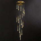Twenty glowing drops on the Clérachic Teardrop Crystal Chandelier, gold finish against a dark backdrop.