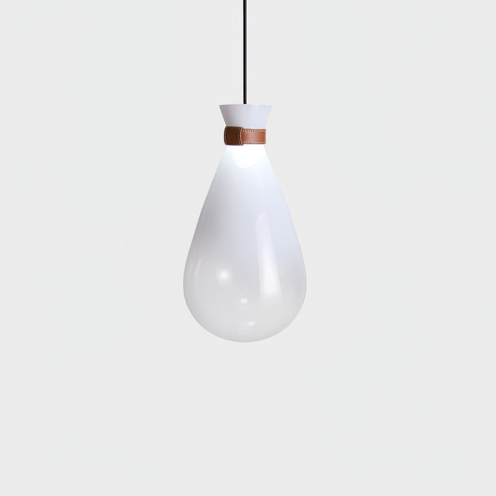 Single white Clérachic teardrop pendant with a leather strap at the neck, glowing softly against a pale grey backdrop.