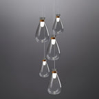 Five Clérachic teardrop pendants in clear grey-tinted glass hung at stepped heights against a dark grey backdrop.
