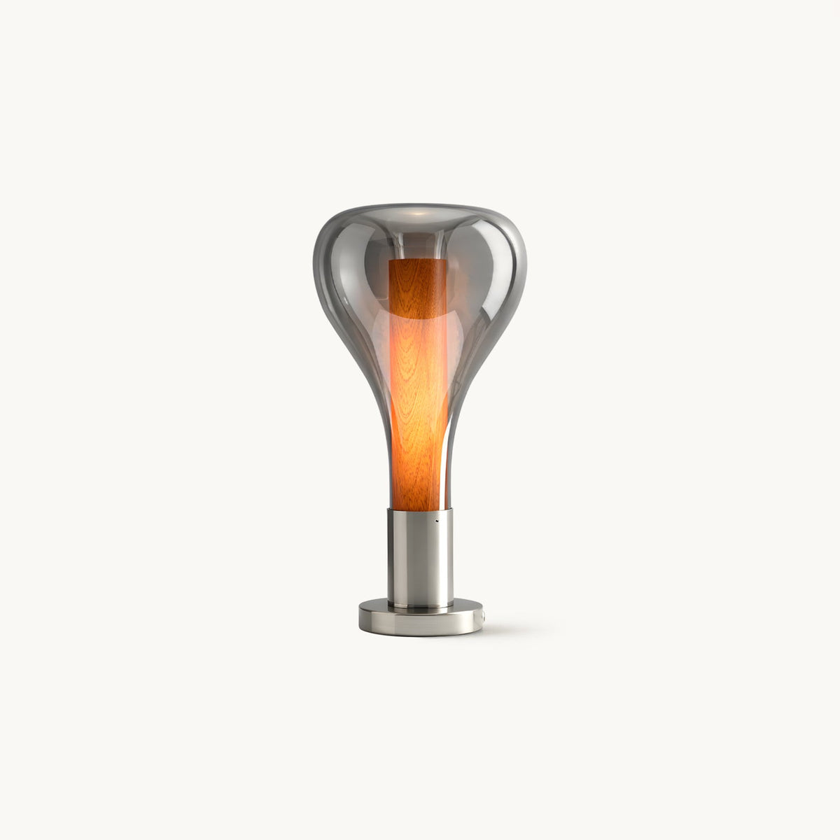 This Clérachic table lamp on a plain white backdrop: a smoke-grey glass teardrop shade around a glowing orange core, on a round chrome base.