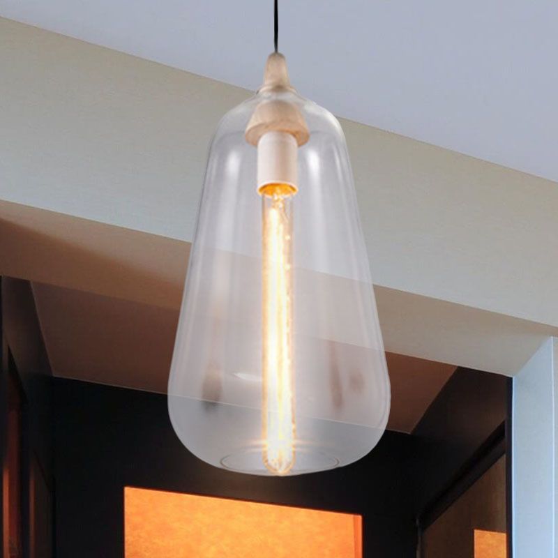 Clérachic teardrop pendant in clear glass, its tube filament bulb fully visible, lit beside a hallway ceiling.