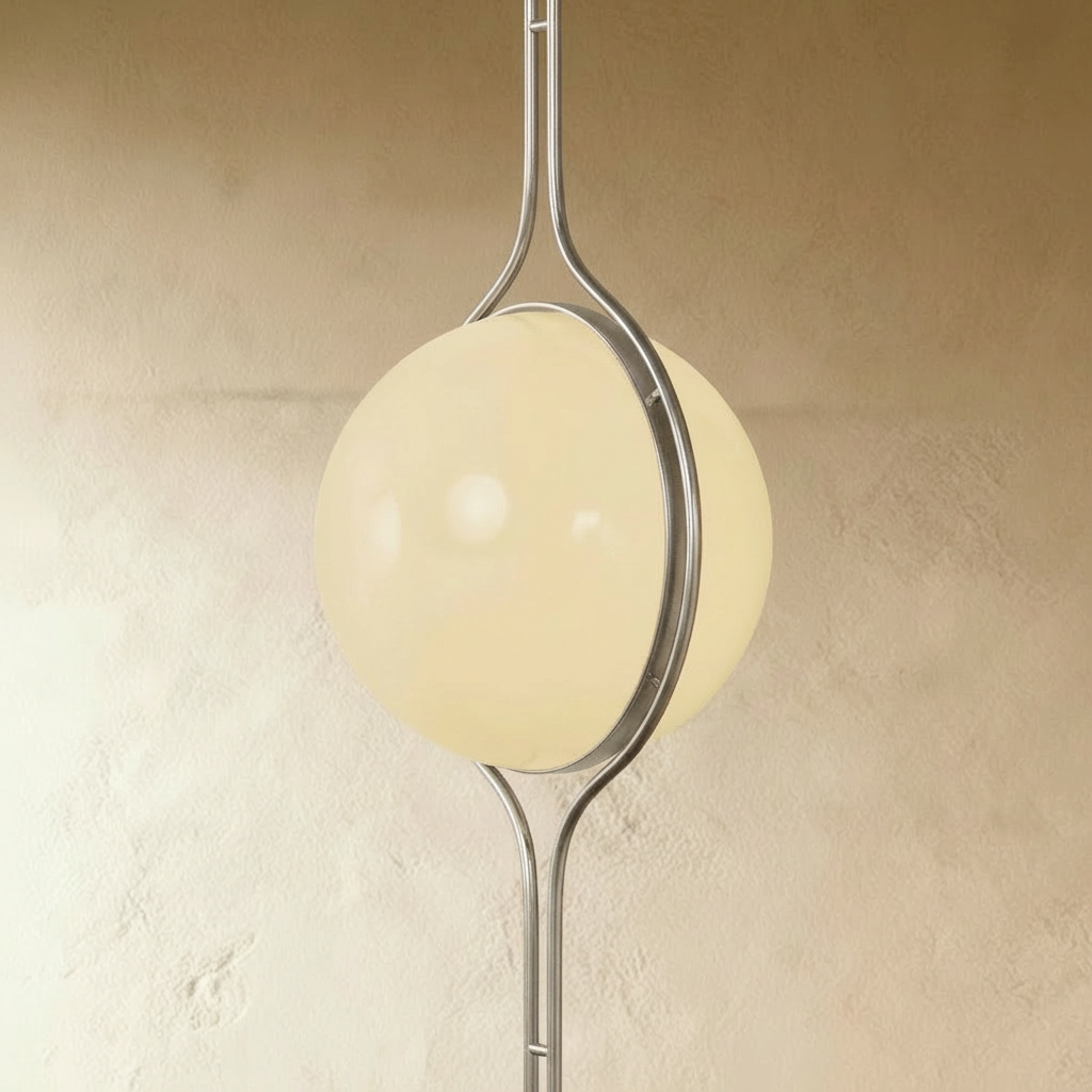 Clérachic floor-to-ceiling lamp in silver, angled to show the two opal halves meeting inside the ring.