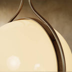 Clérachic floor-to-ceiling lamp in vintage brass, a close view of the ring band seated in the join where the two halves meet.