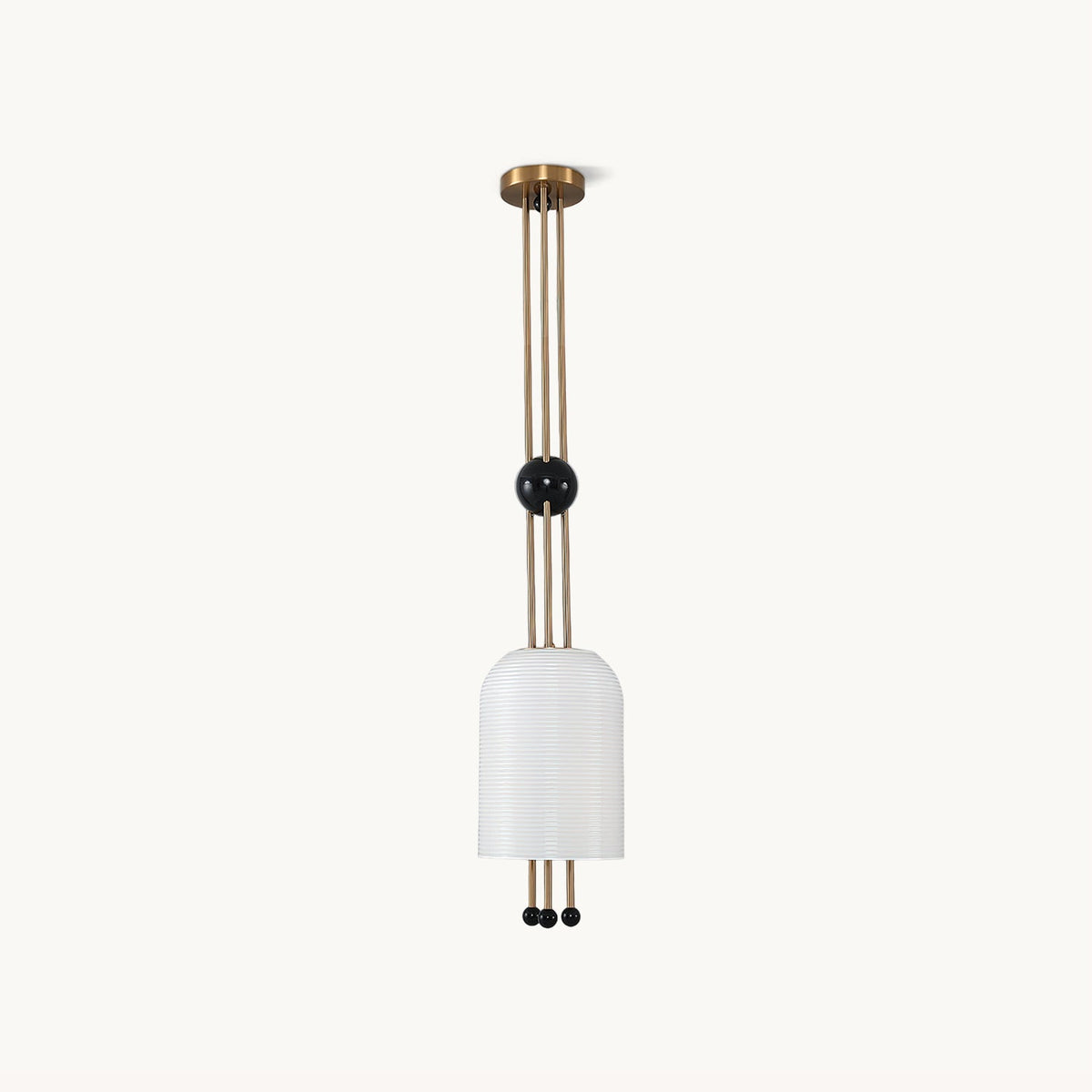 A Clérachic ribbed white cylinder pendant on a plain white backdrop, hung from a brass canopy on three brass rods with a black ball partway down.