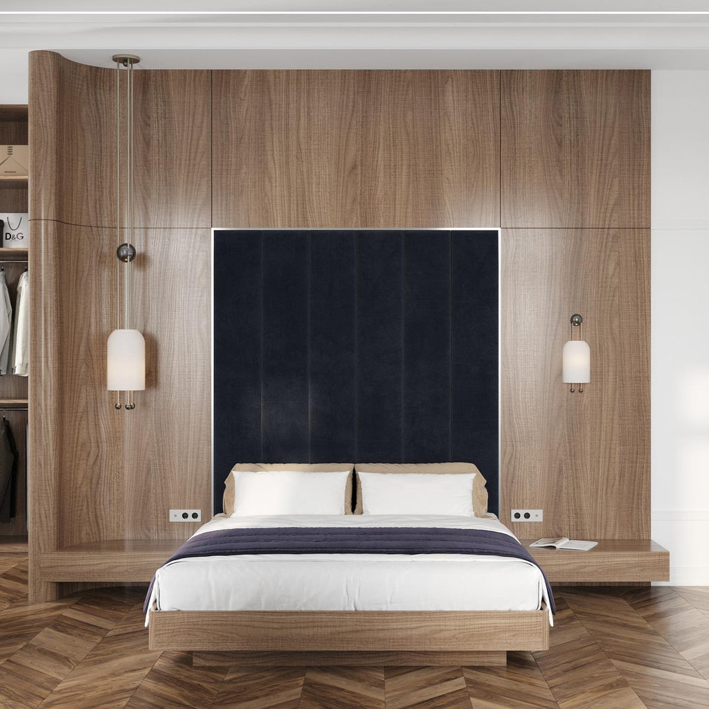 A bedroom with oak wall panels, a navy headboard and two small Clérachic pendants hung either side of the bed.