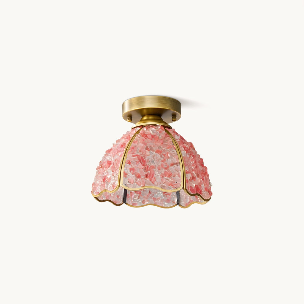 Pink pebble-glass dome ceiling light with a brass canopy and scalloped hem, on a plain white backdrop, from Clérachic.
