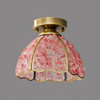 Unlit pink chip-glass dome with brass ribs and a scalloped edge, this Clérachic ceiling light photographed on a mid-grey backdrop.