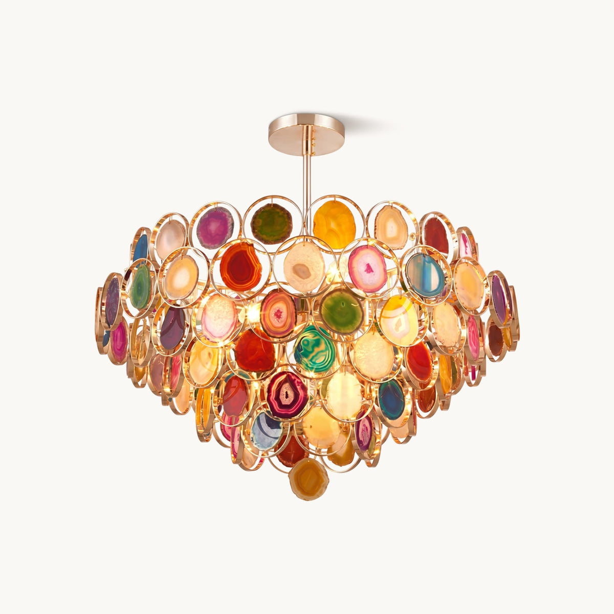 Multicolour agate chandelier from Clérachic on a plain white backdrop, with tiers of stone slices in gold-toned rings on a short ceiling rod.