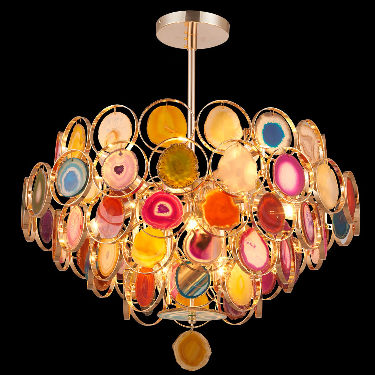 Clérachic agate chandelier on a black background, with warm light inside and a single amber slice hanging beneath.