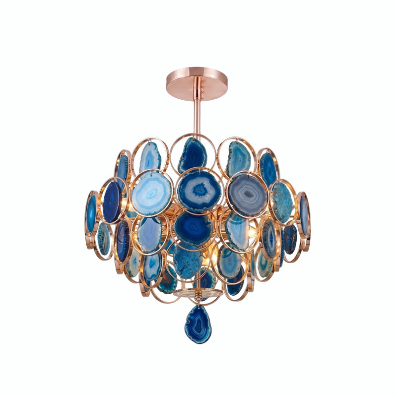 Clérachic agate chandelier on white, its slices in blue and teal with a blue slice hanging at the base.