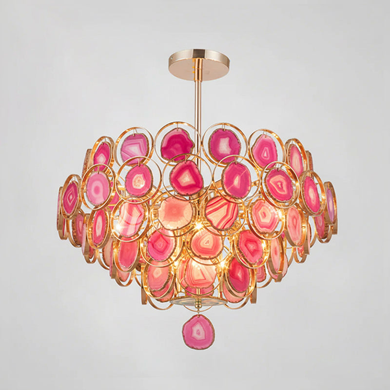 Pink Clérachic agate chandelier on a grey backdrop, its slices from soft blush to deep magenta with a pink pendant slice.
