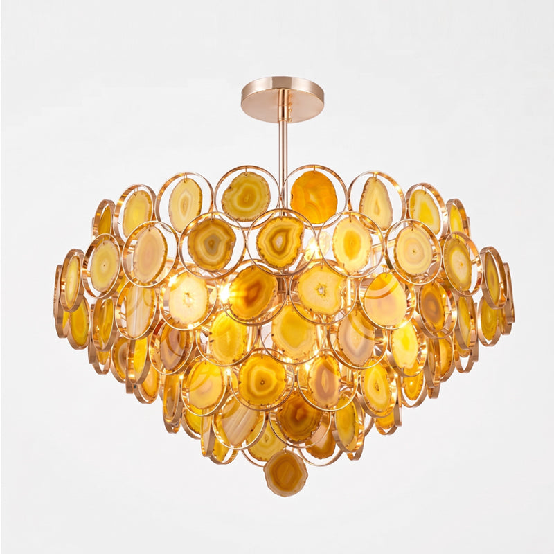 The larger Clérachic agate chandelier in amber and gold stone slices, with many tiers on a short rose-gold rod.