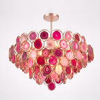 Large pink Clérachic agate chandelier on a pale background, its tiers ranging from blush to deep raspberry.