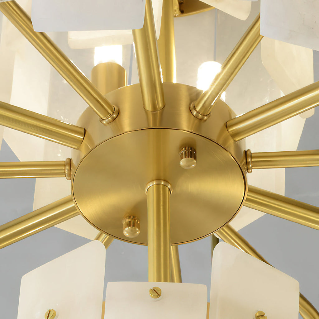 Underside of the Clérachic Tiered Alabaster Chandelier: a brushed brass hub with radial arms holding the stone slabs.